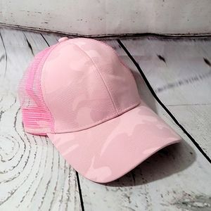 All pink camoflauge pony tail trucker hat.